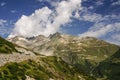 View through Alps valley near Gletch with Furka pass mountain road, Switzerland