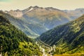 View through Alps valley near Gletch with Furka pass mountain road, Switzerland