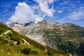 View through Alps valley near Gletch with Furka pass mountain road, Switzerland