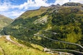 View through Alps valley near Gletch with Furka pass mountain road, Switzerland