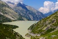 View through Alps valley near Gletch with Furka pass mountain road, Switzerland