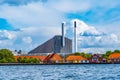 View of Amager Bakke factory with skiing slope on the rooftop in Copenhagen, Denmark
