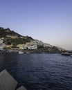 View of Amalfi town at night along the Amalfi coast facing the Mediterranean Sea at sunset, Salerno, Campania, Italy Royalty Free Stock Photo