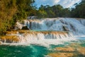 View of the amazing waterfall with turquoise pool surrounded by green trees. Agua Azul, Chiapas, Palenque, Mexico Royalty Free Stock Photo