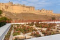 View of Amber fort and palace from Kesar Kyari Bagh garden on Maotha Lake. Rajasthan. India