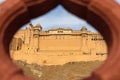 View of Amber fort and palace from Kesar Kyari Bagh garden on Maotha Lake. Rajasthan. India