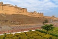 View of Amber fort and palace from Kesar Kyari Bagh garden on Maotha Lake. Rajasthan. India