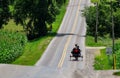 View of an Amish Horse and Buggy Approaching Down a Rural Road Royalty Free Stock Photo