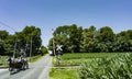 View of An Amish Horse and Carriage Traveling Down a Rural Country Road Royalty Free Stock Photo