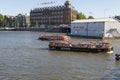 View of the Amsterdam embankment and passing pleasure boats Royalty Free Stock Photo