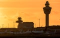 View on Amsterdam Schiphol International Airport with planes at the gates at sunset. Amsterdam, The Netherlands - January 9, 2019