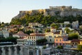 View of the ancient Acropolis, Erechtheion, from Monasteraki Square through old town buildings and Hadrian`s Library ruins Royalty Free Stock Photo