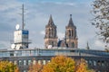 View at ancient Cathedral of Magdeburg and local modern TV broadcast company building MDR during golden Autumn at rainy sky and