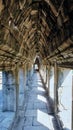 A view of an ancient corridor featuring a stone vaulted ceiling, showcasing architectural detail