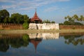 View of ancient gate and bastion of the Old city in the solar evening. Mandalay, Myanmar