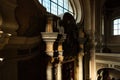 View of an ancient Gothic cathedral with a large ornate statue in the foreground