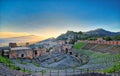 View of the ancient greek theater of Taormina with Etna volcano