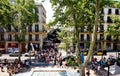 View of the ancient market `Boqueria` and the La Rambla in Barcelona.