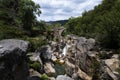 View of the ancient Mizarela Bridge or DevilÃ¢â¬â¢s Bridge with a waterfall, at the Peneda Geres National Park Royalty Free Stock Photo