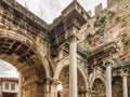 View of ancient monument Hadrian`s Gate Uckapilar in old city of Antalya Kaleici, Turkey. Horizontal image Royalty Free Stock Photo