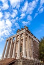 Exterior view of ancient roman colonnade in front of medieval catholic church in Rome