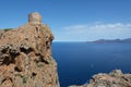 View of an ancient stone tower on a cliff above the sea Royalty Free Stock Photo