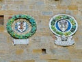 View of an ancient stone wall with beautiful family coats of arms Royalty Free Stock Photo