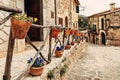 View of the ancient streets of Valldemossa. violets in clay pots on the hedge Royalty Free Stock Photo