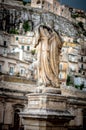 Ancient town Modica and sculptures of the church or Dome of San Pietr , Sicily, Italy