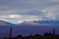 Andean volcanoes covered by clouds and snow, Atacama Desert, Chile Royalty Free Stock Photo