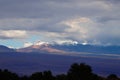 Andean volcanoes covered by clouds and snow, Atacama Desert, Chile Royalty Free Stock Photo