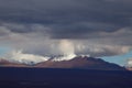 Andean volcanoes covered by clouds and snow, Atacama Desert, Chile Royalty Free Stock Photo