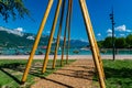 View of Annecy lake, boats with tourists and Alps mountains on sunny day with blue sky in Annecy city. Royalty Free Stock Photo