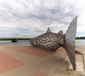 View of the anniversary celebration sculpture of a large metal salmon in the city center of Tornio