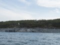 View of Anonjalmme over lake Akkajaure, saami setllement with group of hiker people waiting for the boat to Ritsem