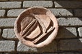 View of antique color orange pottery pot on wall in stone background