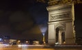 View of Arc de Triomphe at night.