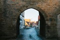 View through the arch to a beautiful street with traditional German houses in Rothenburg ob der Tauber in Germany Royalty Free Stock Photo