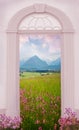 View through arched door, allgau landscape with lychnis meadow