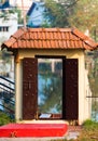 View of the arched door in the fence, Kerala, India. Vertical. With selective focus