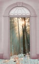 View through arched door, wintry forest