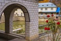 View from arched openings to the pond and residential building. Background with copy space for text