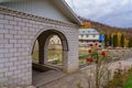 View from arched openings to the pond and residential building. Background with copy space for text