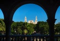 View through arches to the cathedral of Merida over the main square park `Plaza Grande` in Merida, Yucatan, Mexico Royalty Free Stock Photo