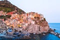 Stunning view of the beautiful and cozy village of Manarola in the Cinque Terre Reserve at sunset. Royalty Free Stock Photo