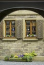 View through archway to idyllic house facade of sandstone