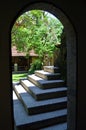 View of the archway to the street and the stairs upwards.