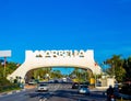 View of Arco bienvenida Marbella above the road with passing cars. Spain.