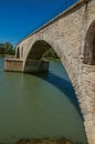 View of the arcs of the Pont d`Avignon bridge under a sunny blue sky, city of Avignon. Royalty Free Stock Photo