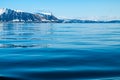 A view of the Arctic island from the sea, beyond the ocean.